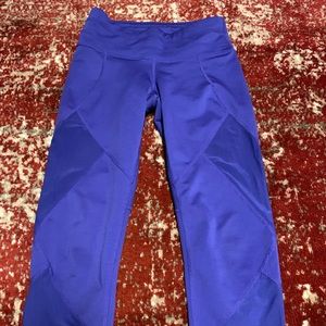 Athleta cropped yoga pants with mesh cutouts.